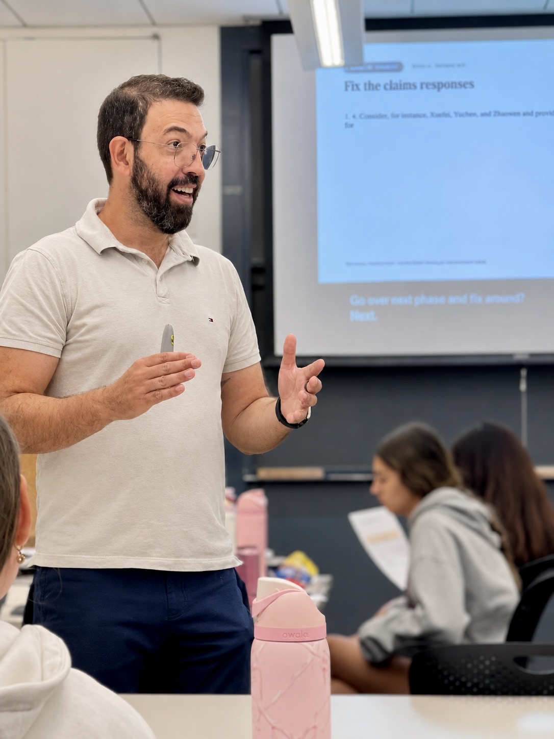 Mayron Piccolo teaching a classroom workshop, students working alongside